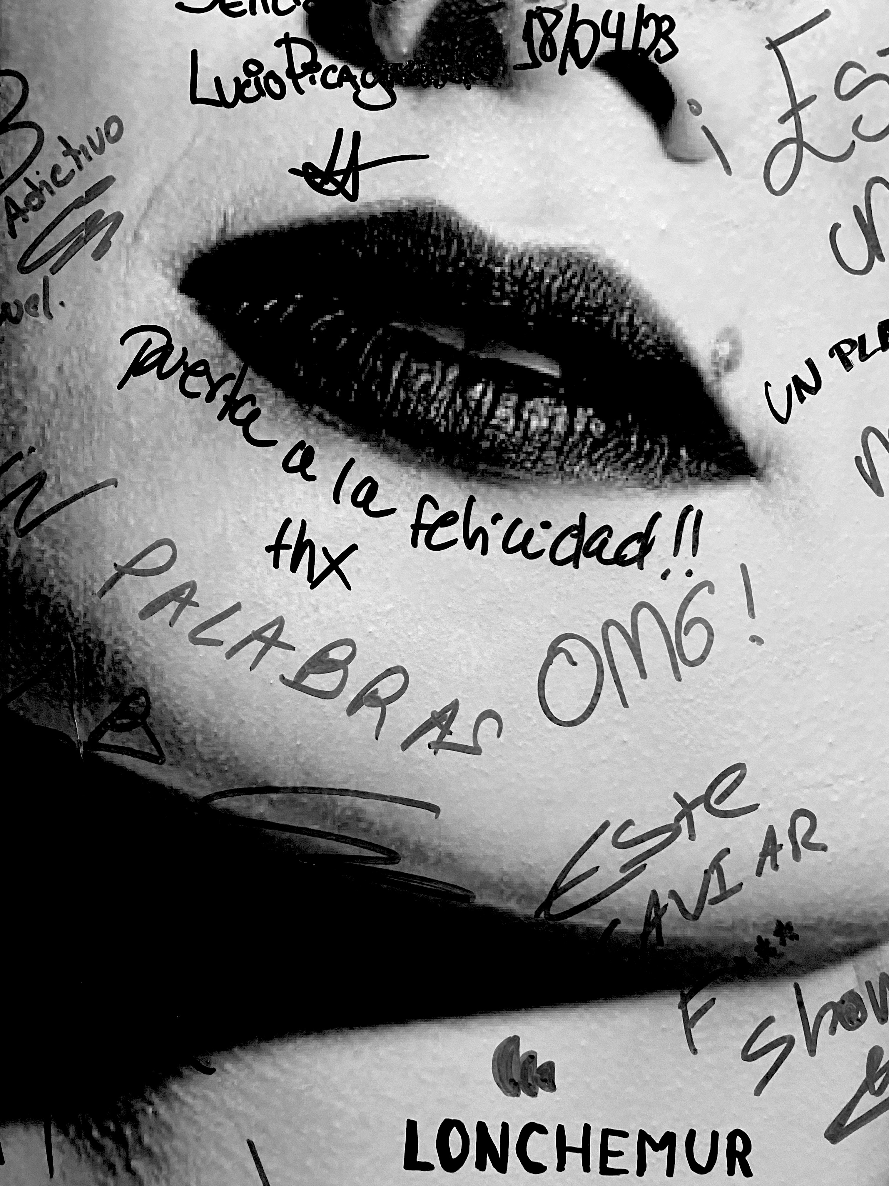 Handwritten artwork around black lips